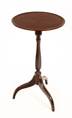 Lot 524 - A circular mahogany stand on a turned column...