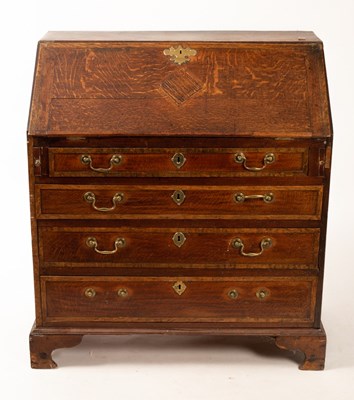 Lot 553 - A George III oak bureau fitted beneath the...