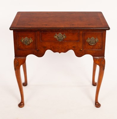 Lot 564 - A burr yew kneehole table with surround of...