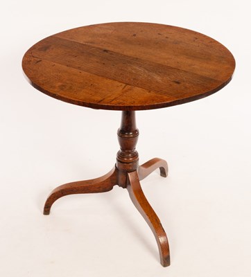 Lot 570 - A 19th Century circular oak table on a turned...