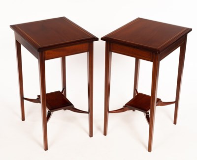 Lot 574 - A pair of Edwardian two-tier tables on square...