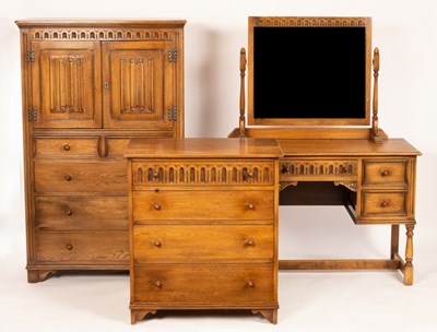 Lot 576 - An oak millinery cupboard enclosed by a pair...