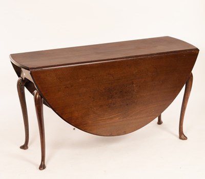 Lot 586 - A George II mahogany oval two-flap dining...