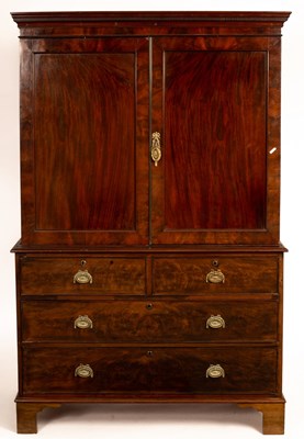 Lot 589 - A Regency mahogany linen press fitted sliding...