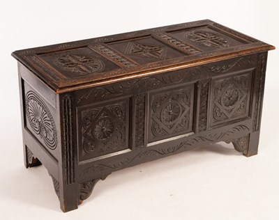 Lot 606 - An early 19th Century carved oak chest with...