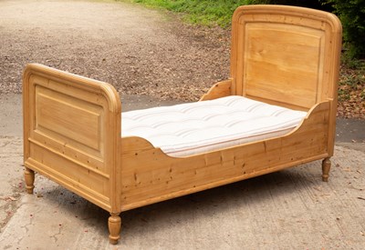 Lot 615 - A pine single bed with mattress, rounded edges...