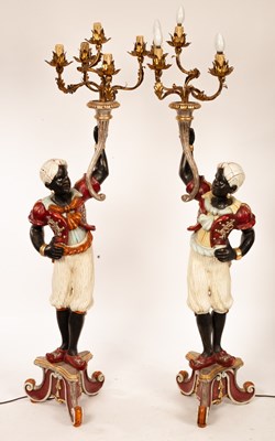 Lot 622 - A pair of Venetian style blackamoor candelabra...