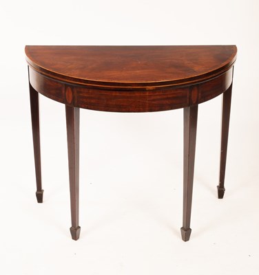 Lot 632 - A George III half-round card table, the fold...