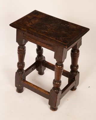 Lot 637 - A 17th Century oak joint stool, on turned legs,...