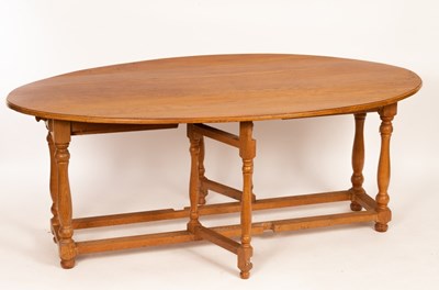 Lot 641 - A 20th Century oak wake table, the top 193cm x...