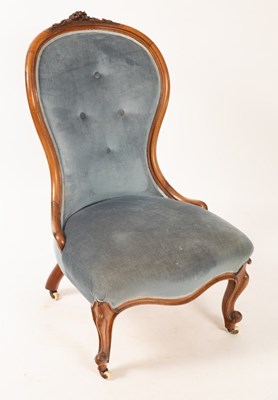 Lot 650 - A Victorian fireside chair with button back