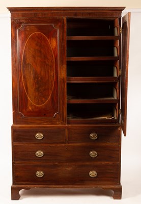 Lot 666 - A George III mahogany linen press, fitted...