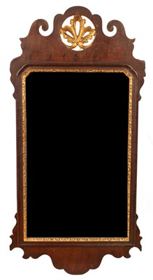 Lot 674 - A 19th Century walnut fret cut mirror with...