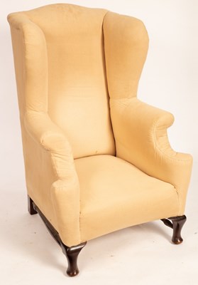 Lot 688 - A Georgian style wingback armchair