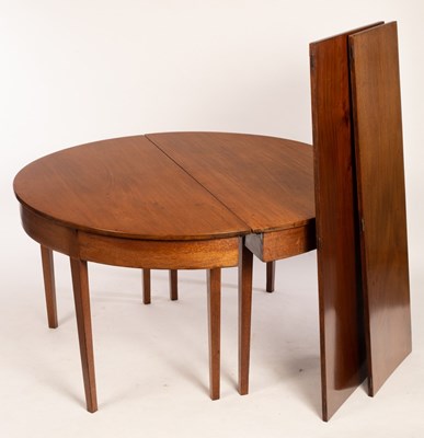 Lot 693 - A mahogany dining table on square tapering...