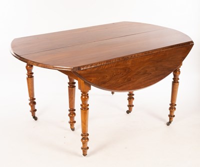 Lot 708 - A French provincial walnut drop leaf dining...