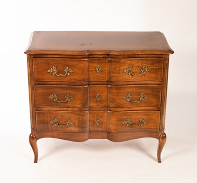 Lot 716 - A French walnut commode, the serpentine front...