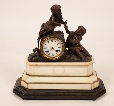 Lot 740 - A mantel clock with putto surmount, 40cm high