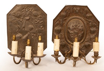 Lot 754 - Two embossed brass wall sconces, each set...