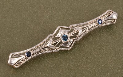 Lot 65 - An Edwardian style 14k yellow and white gold sapphire and zircon bar brooch