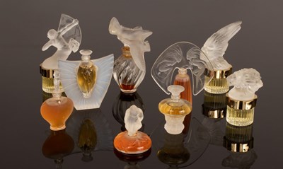 Lot 14 - Nine miniature perfume bottles designed by...