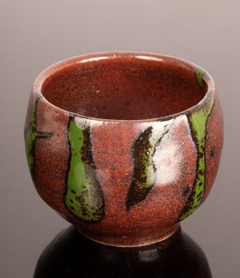 Lot 53 - A studio pottery sake cup, red and green...