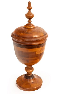 Lot 155 - A Contemporary parquetry wooden vase and cover,...