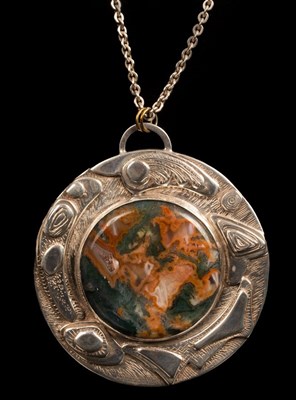 Lot 339 - A silver and moss agate pendant by Helen...