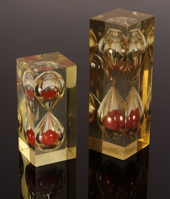 Lot 411 - Two mid-Century lucite hourglass sand timers,...