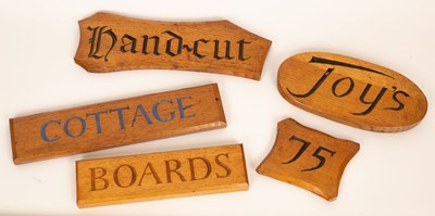 Lot 432 - Joy Evans, five samples of wooden house signs,...