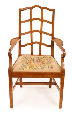 Lot 446 - A walnut armchair of Cotswold School design...