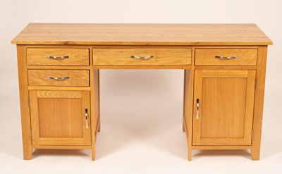 Lot 502 - A Camberley oak double pedestal desk, 157cm wide