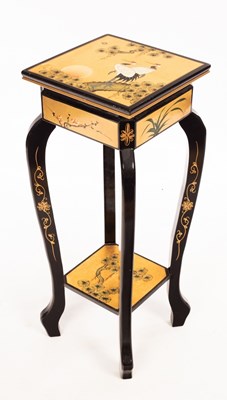 Lot 503 - A Japanese lacquer jardinière stand decorated...