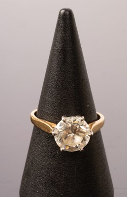 Lot 5 - A diamond solitaire ring, the claw set stone...