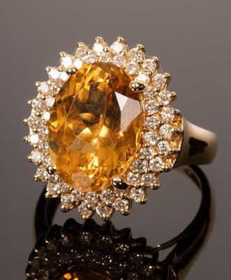 Lot 14 - A citrine and diamond cocktail ring, the large...