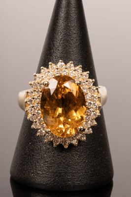 Lot 14 - A citrine and diamond cocktail ring, the large...