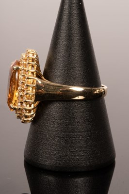 Lot 14 - A citrine and diamond cocktail ring, the large...