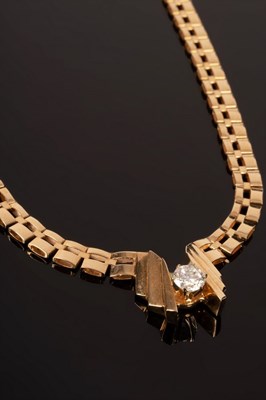 Lot 15 - A diamond and 14k yellow gold necklace centred...