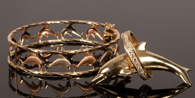 Lot 19 - An Italian bi-colour 14k gold bangle with...