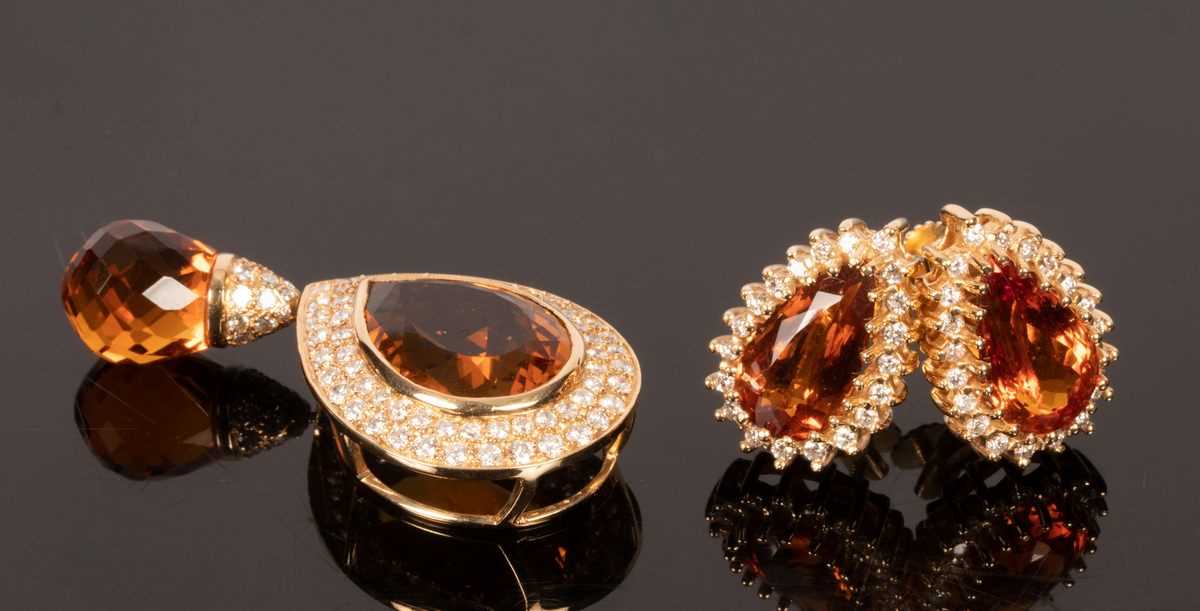 Lot 20 - A citrine and diamond pendant, the inverted...