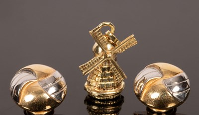 Lot 30 - A 14k gold windmill charm and a pair of 14k...