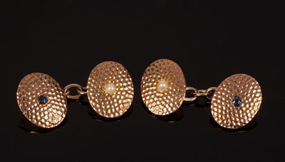 Lot 35 - A pair of 9ct gold oval cufflinks with a...