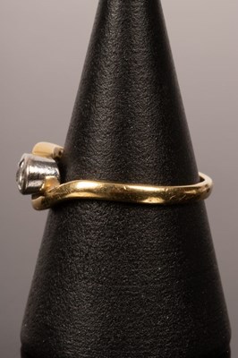 Lot 37 - A diamond three-stone ring in an 18ct yellow...