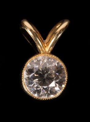 Lot 45 - A round cut diamond mounted as a pendant in...