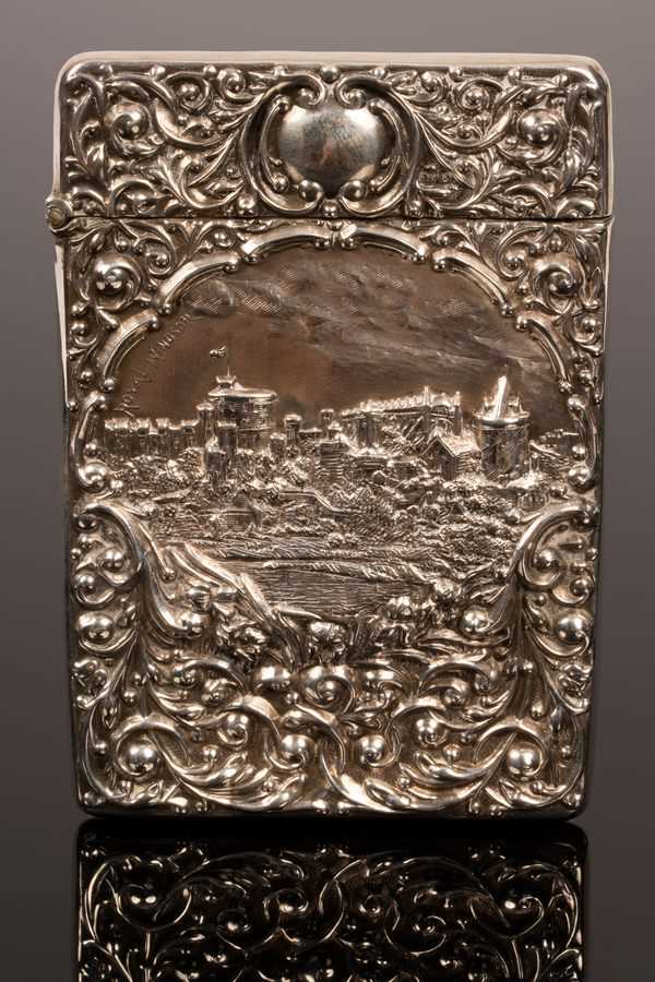 Lot 107 - A castle top embossed silver visiting card...