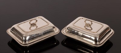 Lot 117 - A pair of George III silver entrée dishes and...