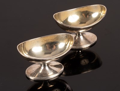 Lot 138 - A pair of George III oval silver salts, John...