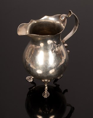 Lot 155 - A Georgian silver jug, marks rubbed, the...