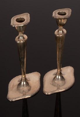 Lot 168 - A pair of Edwardian silver candlesticks,...