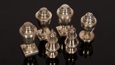 Lot 182 - A pair of Victorian silver pepper pots, George...